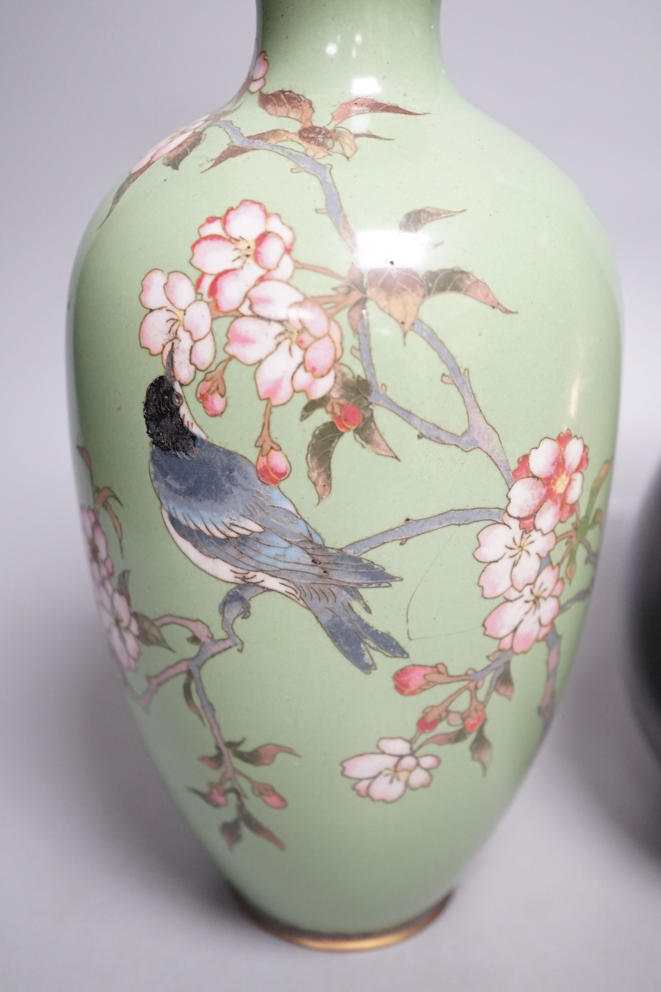 A Japanese cloisonné enamel vase and a Japanese mixed metal vase, cloisonné vase 25 cms high.